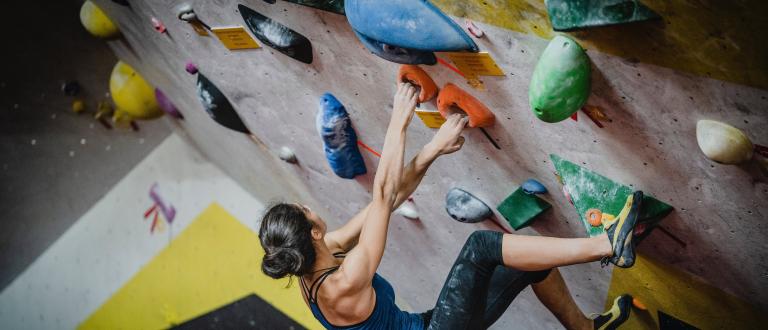 Woman on rock climbing wall