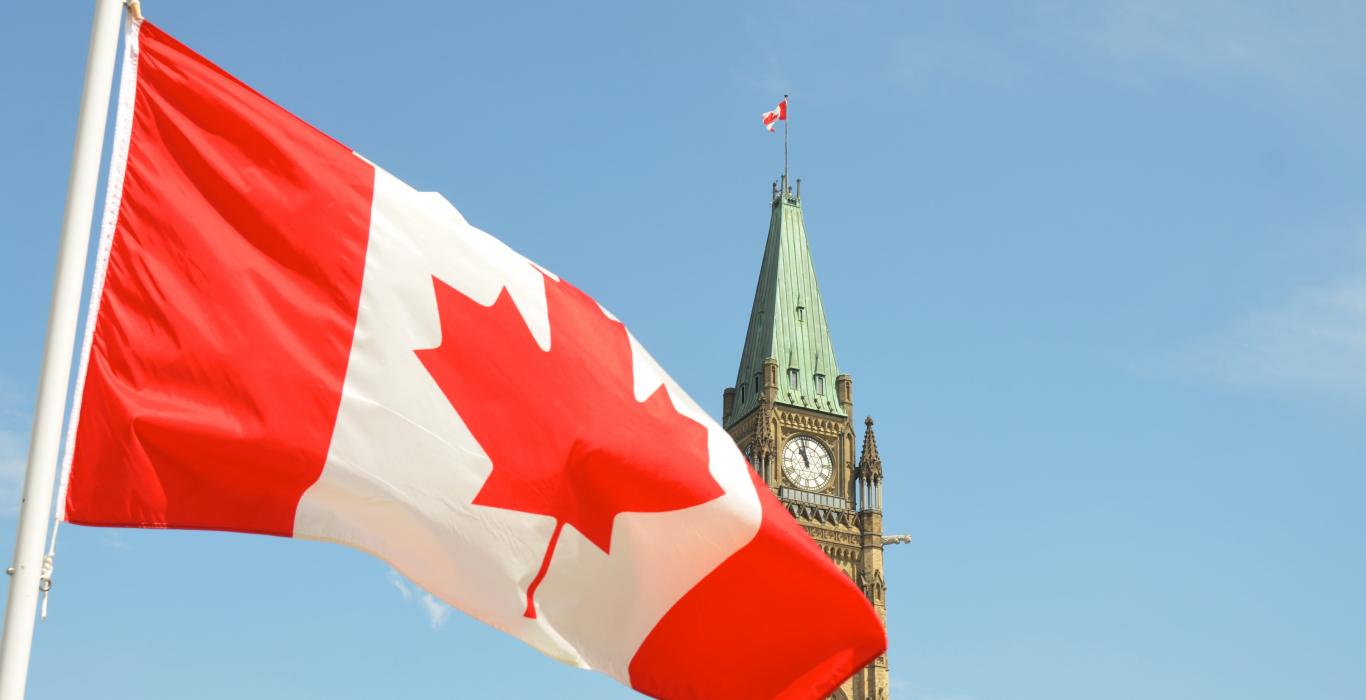 Canada flag in front of parliament