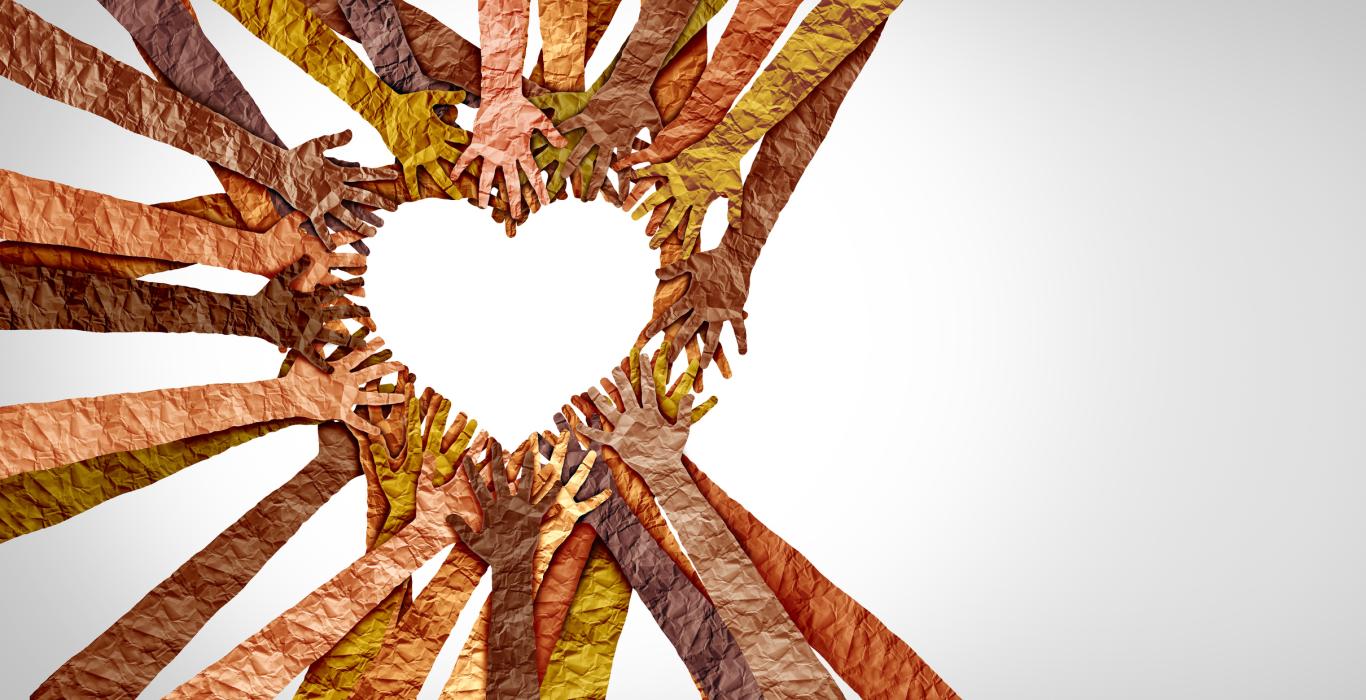 arms and hands reaching out to make a heart