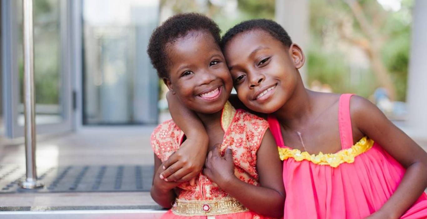 Image of two young girls smiling