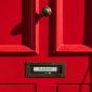 No junk mail sticker on red door
