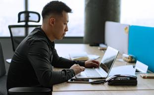 man looking at computer